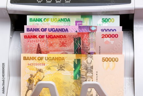 Ugandan shilling in a counting machine photo