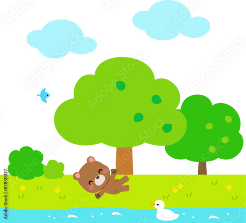 芝生でゴロゴロするクマのキャラクター