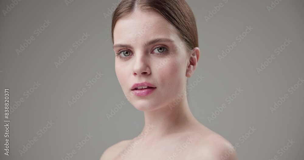 Beauty, health, cosmetics, anti-aging therapy and skin care concept - young beautiful brunette Caucasian woman posing and looking at the camera with a calm confident look Beauty, health, cosmetics, anti-aging therapy and skin care concept - young beautiful brunette Caucasian woman posing and looking at the camera with a calm confident look