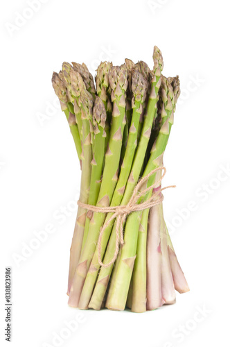 A neat bundle of fresh green asparagus spears tied together with a piece of twine, displayed against a clean white backdrop.