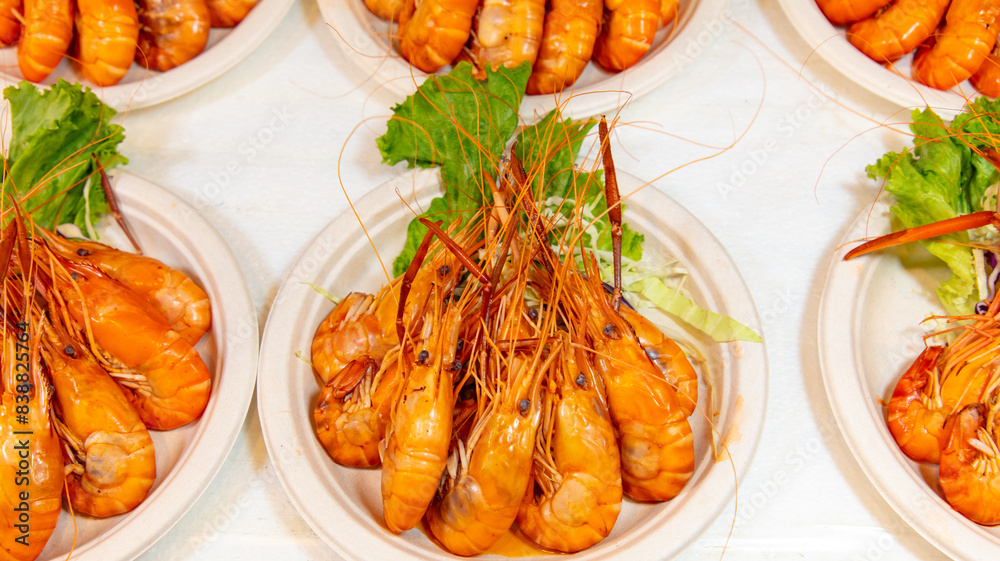 Red boiled crayfish in white plates as a background Red boiled crayfish in white plates as a background