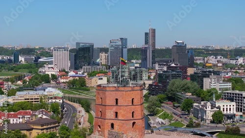 Amazing Drone Shot Above Gediminas Tower, Lithuanian Flag toward Vilnius Business District photo