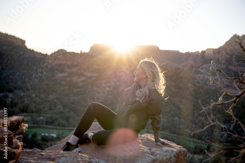 Woman enjoys serene moment after hiking in Sedona.