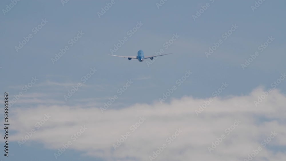 Passenger jet plane in the sky. Airplane flies high above the clouds. Travel concept Passenger jet plane in the sky. Airplane flies high above the clouds. Travel concept