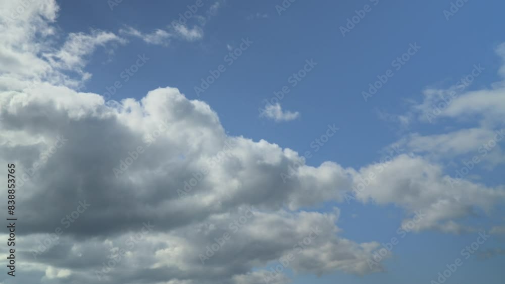 Bright nimbus clouds rolling across the blue sky and boiling off in the sunlight. Time lapse 60x. Bright nimbus clouds rolling across the blue sky and boiling off in the sunlight. Time lapse 60x.