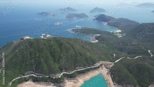 Explore the High Island Reservoir East Dam Geological Trail at Hong Kong Sai Kung's UNESCO Global Geopark, marveling at old volcanic rock formations and coastal vistas photo