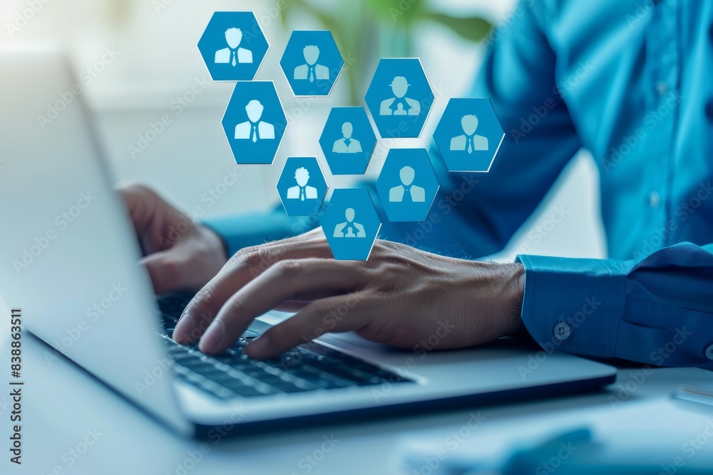 A business person uses a laptop to create target audience ICONS,Digital marketing online, CRM, Data exchanges development and customer service.