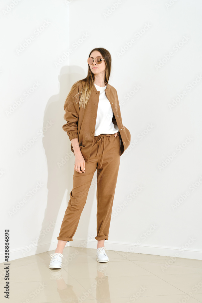Woman in brown jersey sports suit Woman in brown jersey sports suit