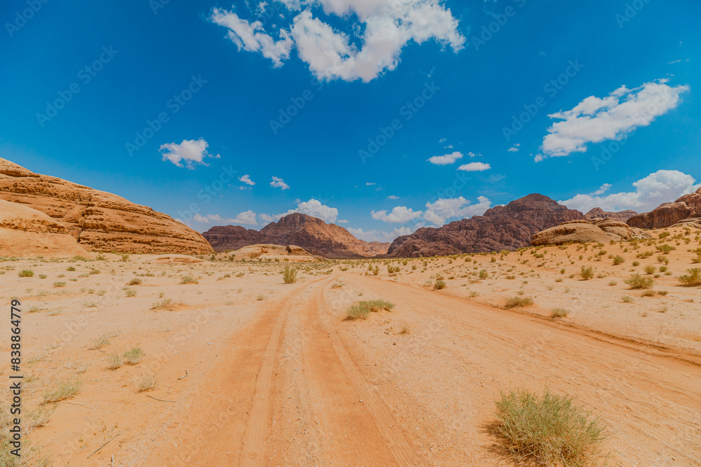 Explore the stunning and majestic Wadi Rum landscape in Jordan, a breathtaking desert with scenic sandstone rock formations, perfect for adventure travel and off the beaten path exploration Explore the stunning and majestic Wadi Rum landscape in Jordan, a breathtaking desert with scenic sandstone rock formations, perfect for adventure travel and off the beaten path exploration