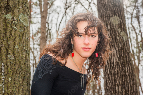 androgynous teen posing in the woods