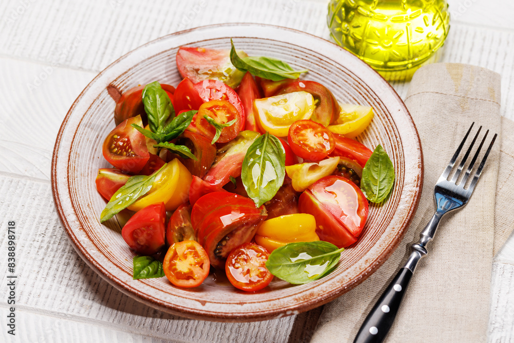 Tomato salad with fresh basil and olive oil Tomato salad with fresh basil and olive oil