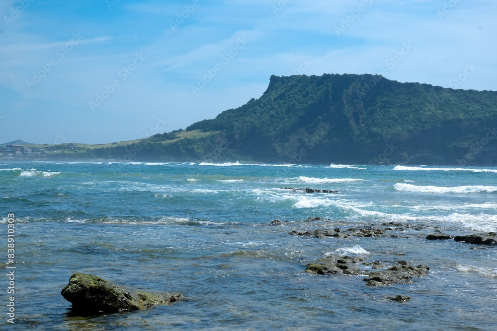 Volcano rocks and coral sand at Beach of Jeju Island at Jeju-do, South Korea Volcano rocks and coral sand at Beach of Jeju Island at Jeju-do, South Korea