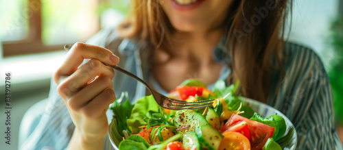 woman eating enjoying healthy food salad