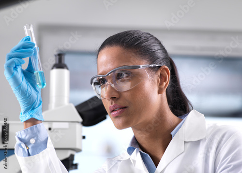 Biotechnology Research, female scientist mixing a chemical formula