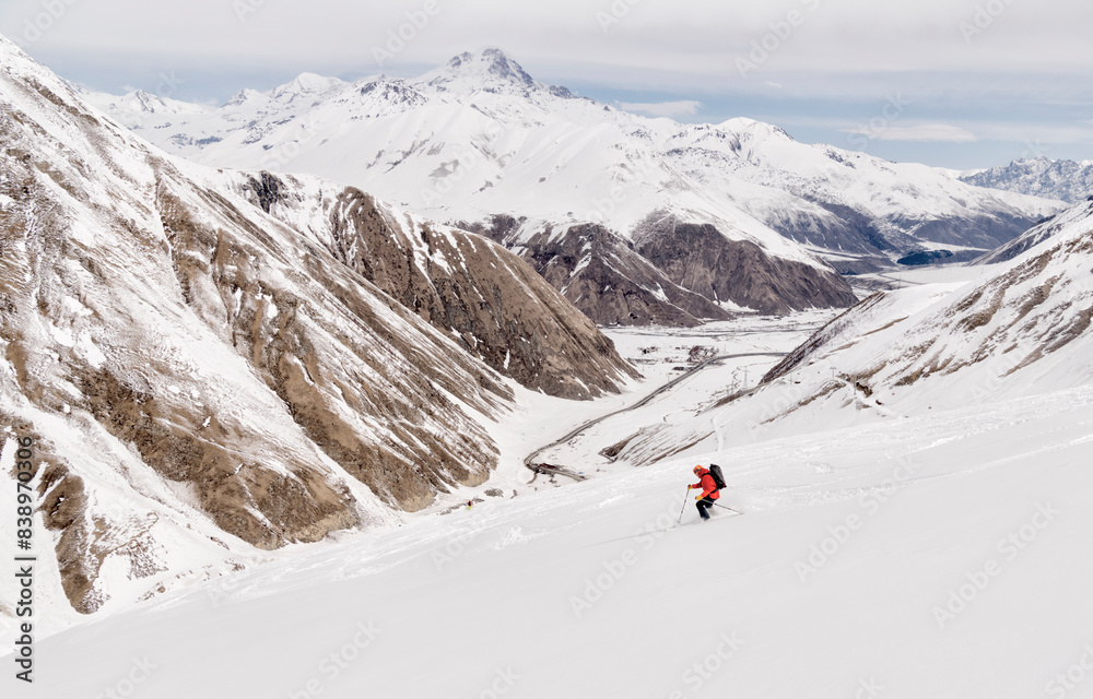 Georgia, Caucasus, Gudauri, man on a ski tour riding downhill Georgia, Caucasus, Gudauri, man on a ski tour riding downhill