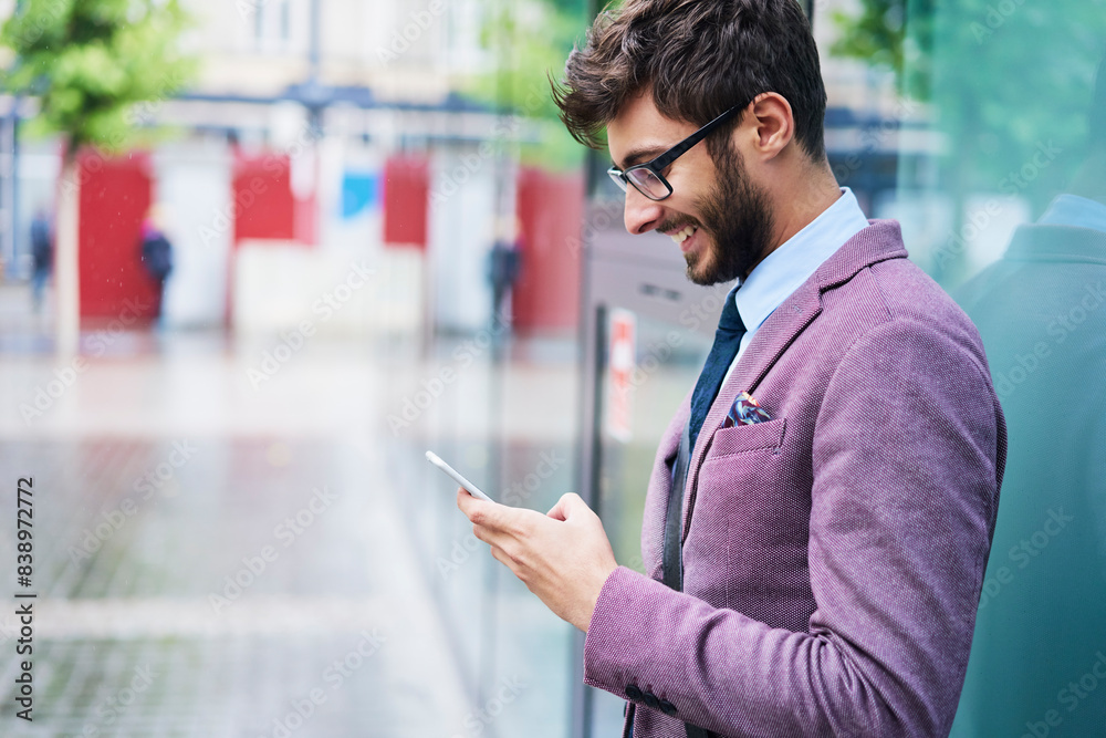 Fashionable businessman checking his cell phone Fashionable businessman checking his cell phone