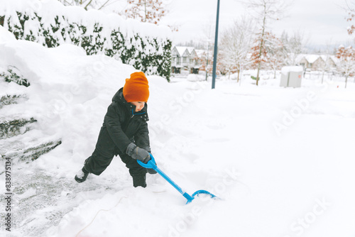 Little boy shoveling snow, Vancouver, Canada © tunedin