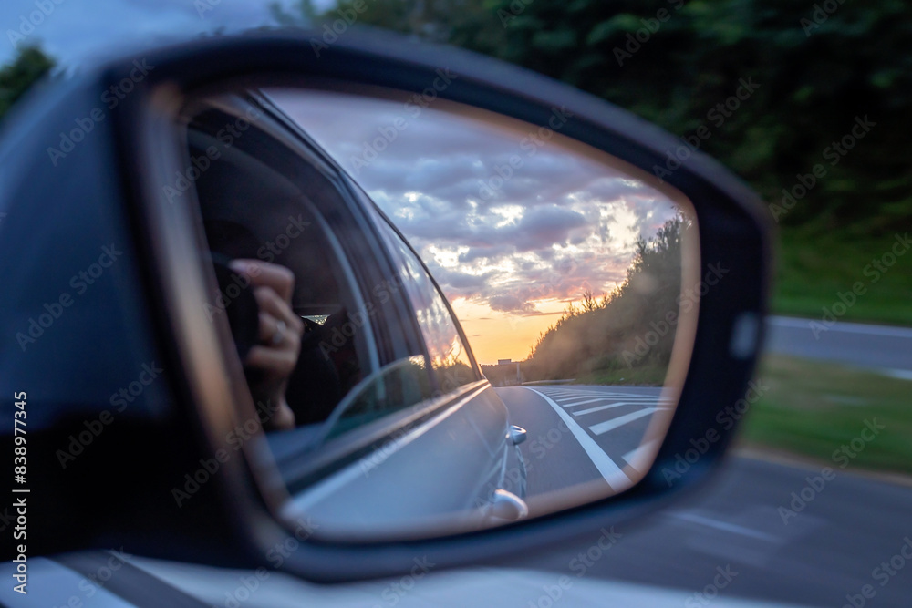 Sunset in car mirror, reflection from the nature Sunset in car mirror, reflection from the nature