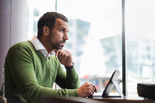 Business man using tablet in cafe