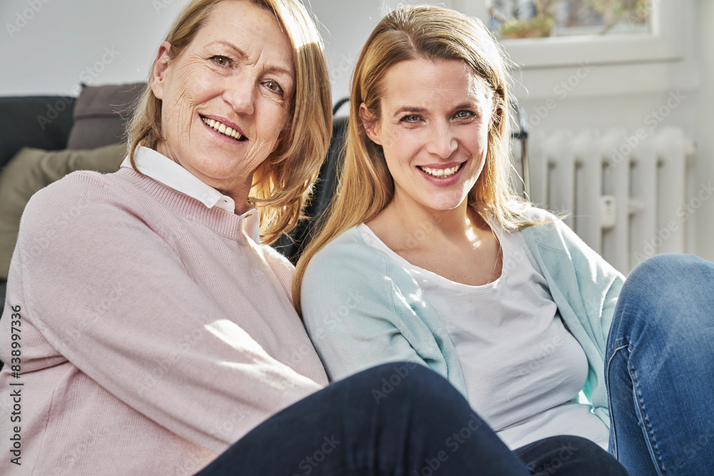Portrait of smiling adult daughter and mother Portrait of smiling adult daughter and mother