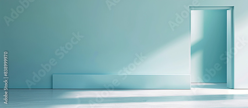 A teal-colored room with an open doorway  allowing light to create a serene  minimalist atmosphere.