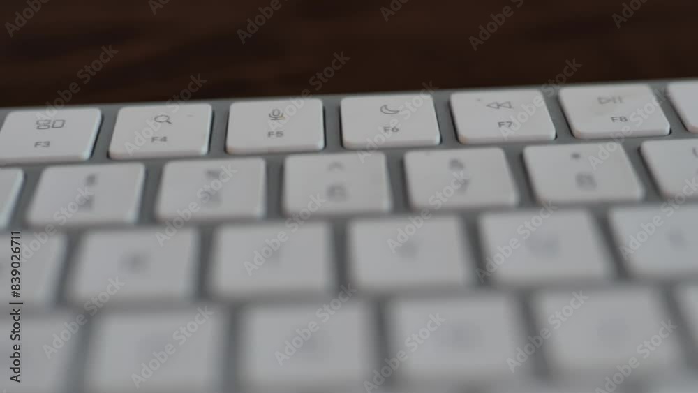 Function buttons on a white keyboard. Close up of F1 to F12 buttons Function buttons on a white keyboard. Close up of F1 to F12 buttons
