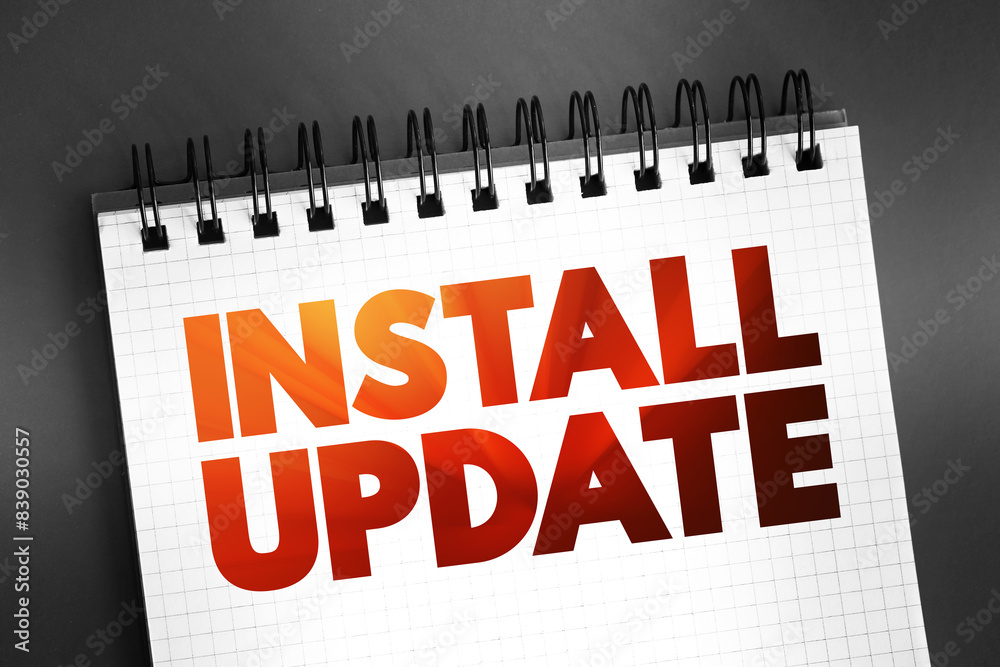 Fototapeta premium Install Update text quote on notepad, concept background