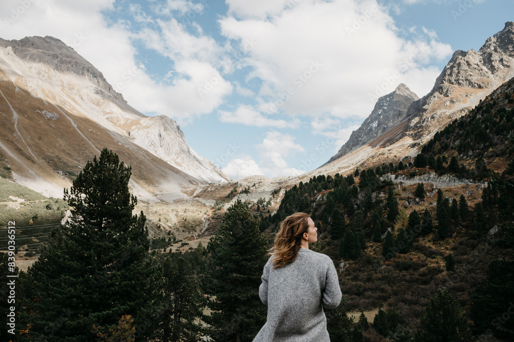 Switzerland, Grisons, Albula Pass, woman standing in mountainscape