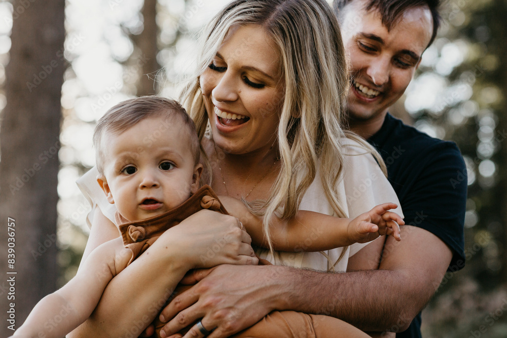 Fototapeta premium Happy mother hugging her little son outdoors