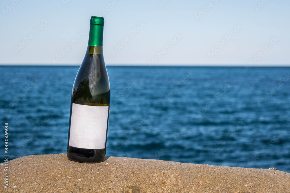 Bottle of wine by the sea