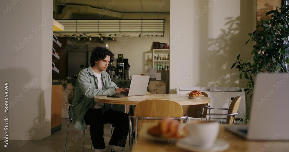 Hispanic Young Man Freelancer Working With Laptop In Cafe In Daytime, Student Programmer Learning Hispanic Young Man Freelancer Working With Laptop In Cafe In Daytime, Student Programmer Learning