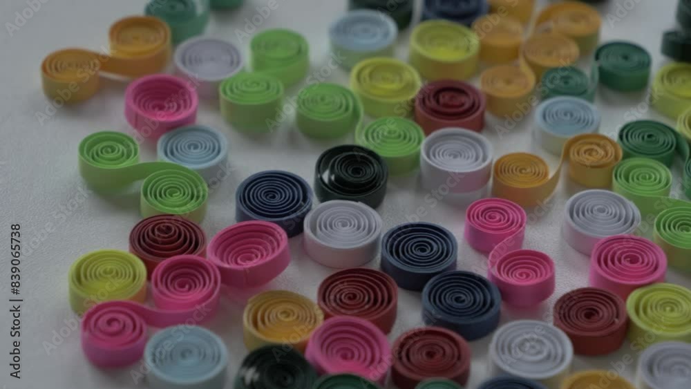 Panning across bright colorful artistic quilling twists, curls, and spirals. Panning across bright colorful artistic quilling twists, curls, and spirals.
