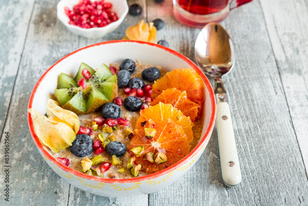 Superfood breakfast with porridge, amaranth, various fruits and pistachios Superfood breakfast with porridge, amaranth, various fruits and pistachios