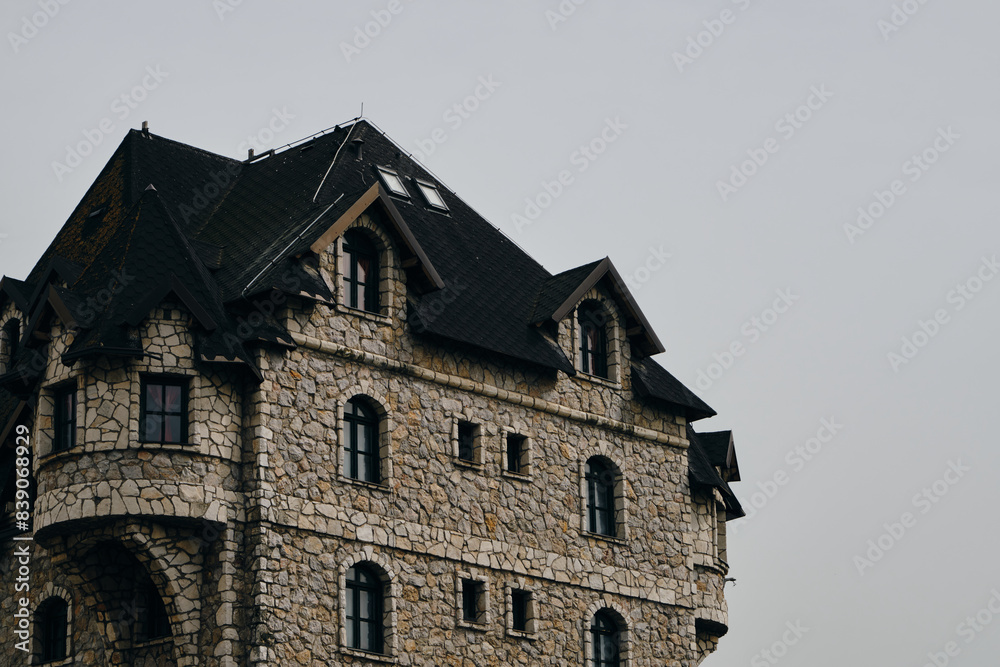 Fototapeta premium The stone house looks like a castle - hotel on the territory of an ethno village Stanisici in Bosnia and Herzegovina country