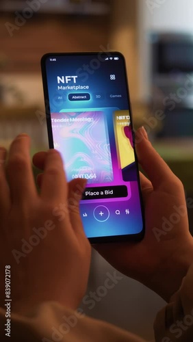 Exploring NFT artworks marketplace. Non-fungible token auction app for mobile phone. Fictional Interface, vertical video.