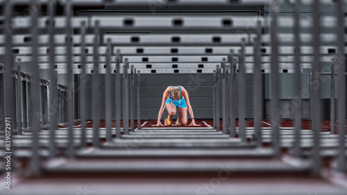 Germany, Baden Wurttemberg, Winterbach, Female hurdler right before sprint