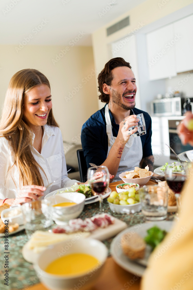 Friends having fun, eating lunch together Friends having fun, eating lunch together
