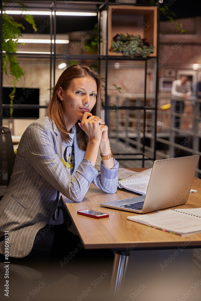 Businesswoman working in modern office, using laptop Businesswoman working in modern office, using laptop