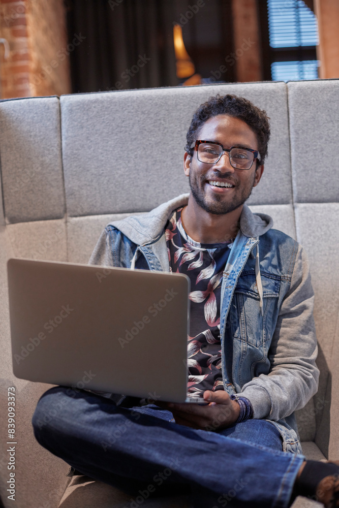 Young man working in creative start-up company, using laptop Young man working in creative start-up company, using laptop