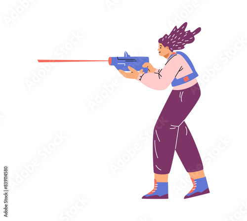 A female player with a laser pistol participates in an exciting game - laser tag.