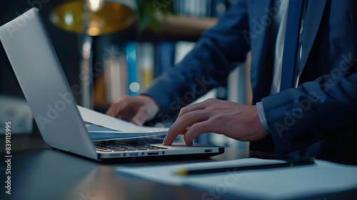 Businessman downloading computer files or installing software on laptop computer with small text Downloading, cloud storage technology, data backup, cyber security 