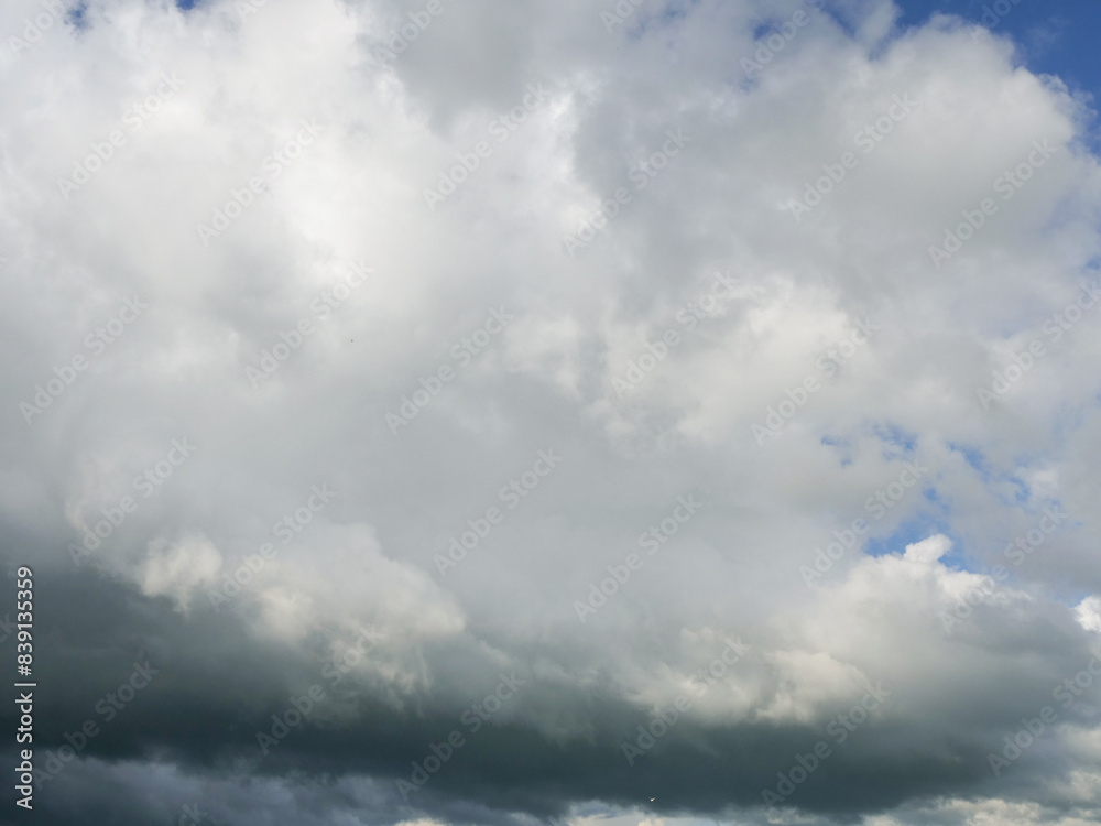 Spectacular and moody blue cloudy sky. Nature background for design. Calm and surreal mood. Spectacular and moody blue cloudy sky. Nature background for design. Calm and surreal mood.