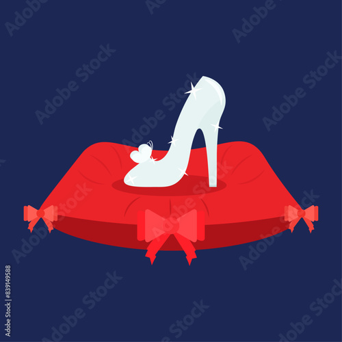 A glass slipper on a pillow.