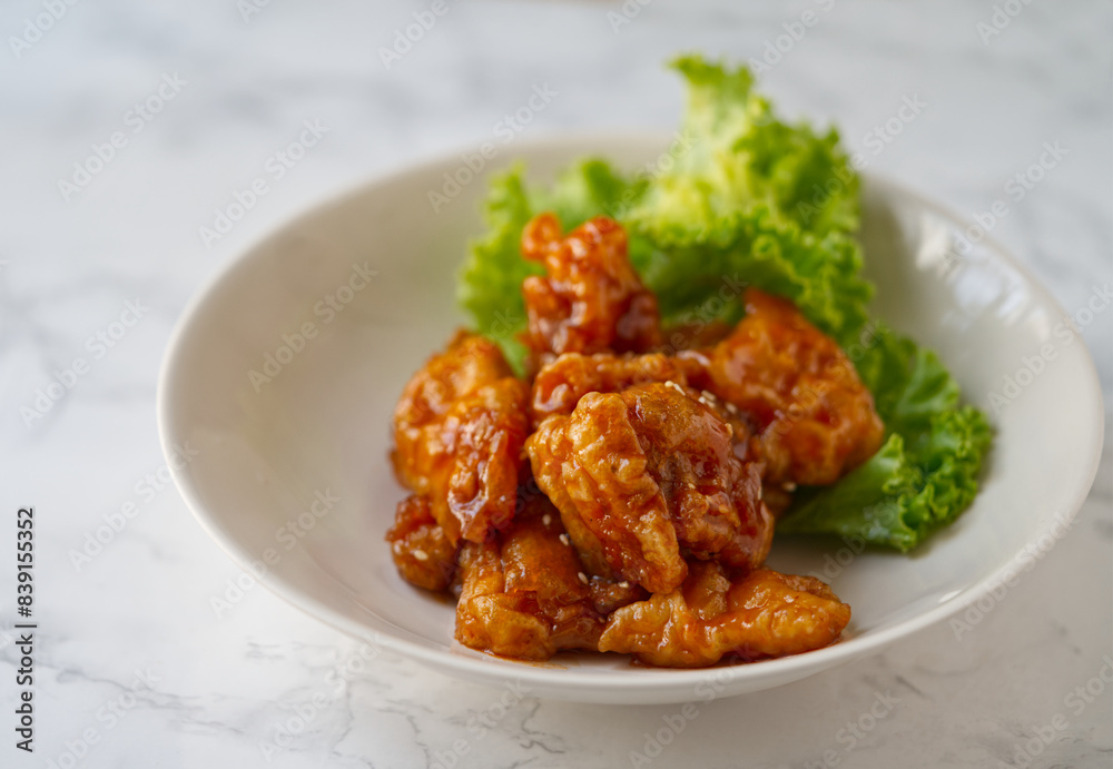 Close up delicious Chinese food menu, Three flavors pork tenderloin. The Chinese menu dish in on a white marble table with natural light. Close up delicious Chinese food menu, Three flavors pork tenderloin. The Chinese menu dish in on a white marble table with natural light.