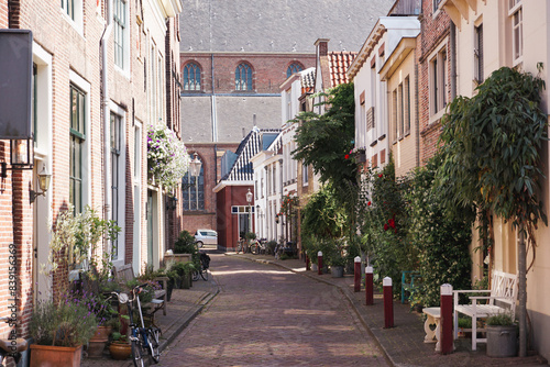 A city street between buildings during the summer
