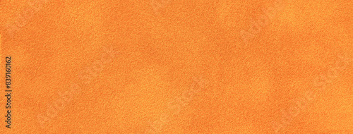Fotografia Bright orange matte background of suede fabric, closeup