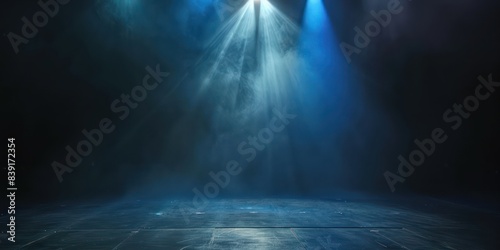 Dark, empty stage illuminated by a single spotlight, creating a dramatic and captivating atmosphere for performances or presentations