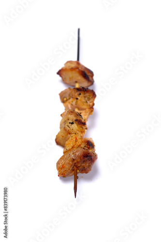 close-up view of delicious kebabs on skewers on white background