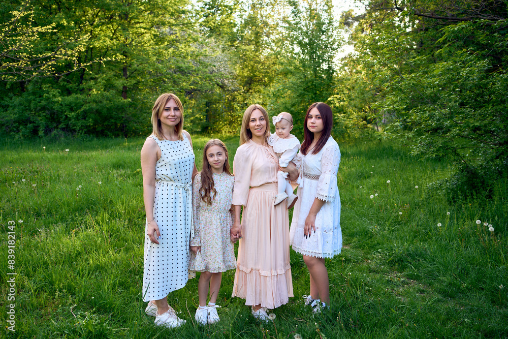 Fototapeta premium family portrait of two women and their three children