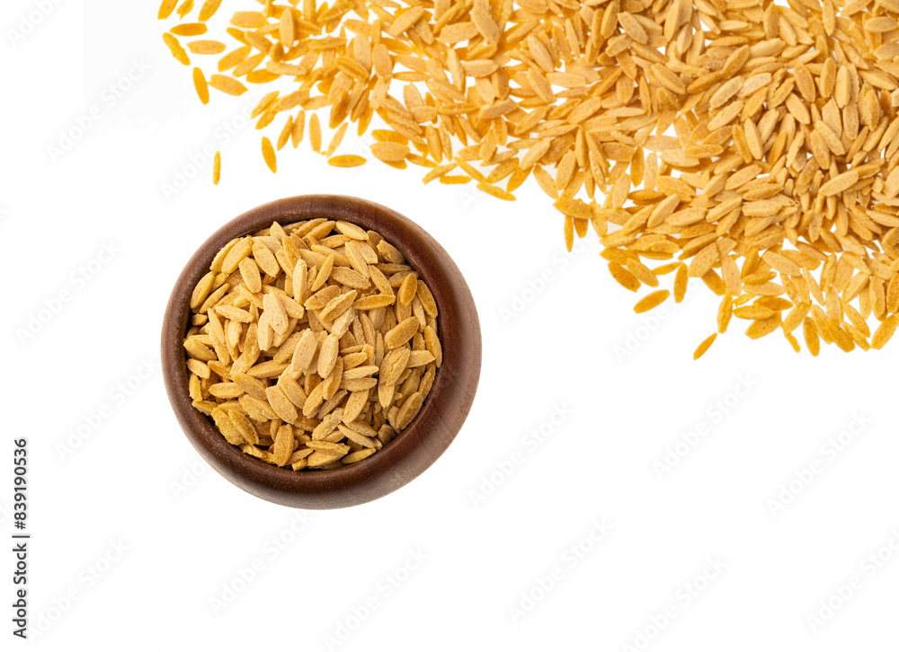 Dried orzo pasta in the bowl - Italian risoni in the form of rice grains Dried orzo pasta in the bowl - Italian risoni in the form of rice grains